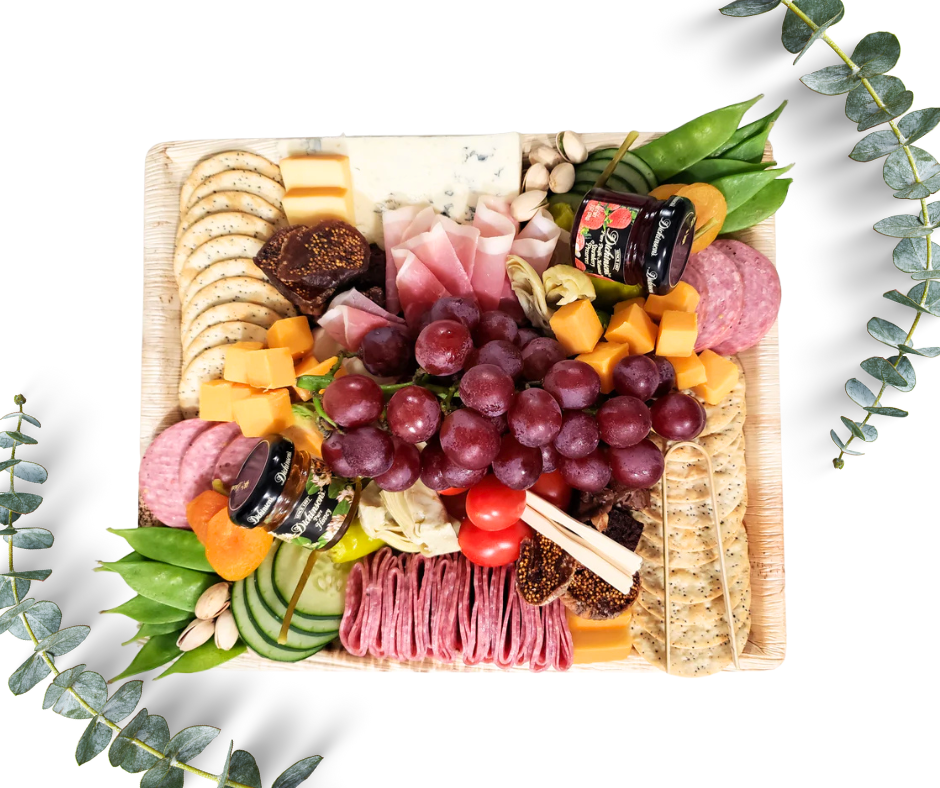Charcuterie Host board on a bamboo tray with cured meat, cheese, vegetables, fresh fruit, nuts, dried fruit, crackers, honey or preserves, pickled items and sweet treats. Serves 4.