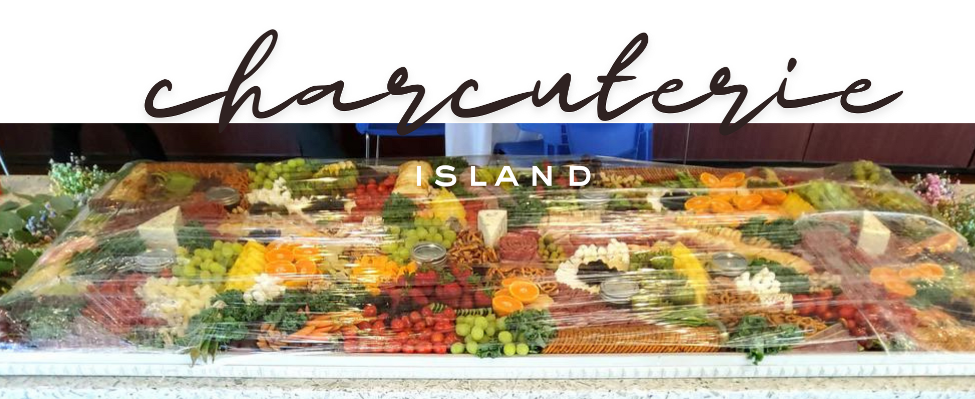 Event-size charcuterie board 72 x 24 inches styled with assorted charcuterie delights