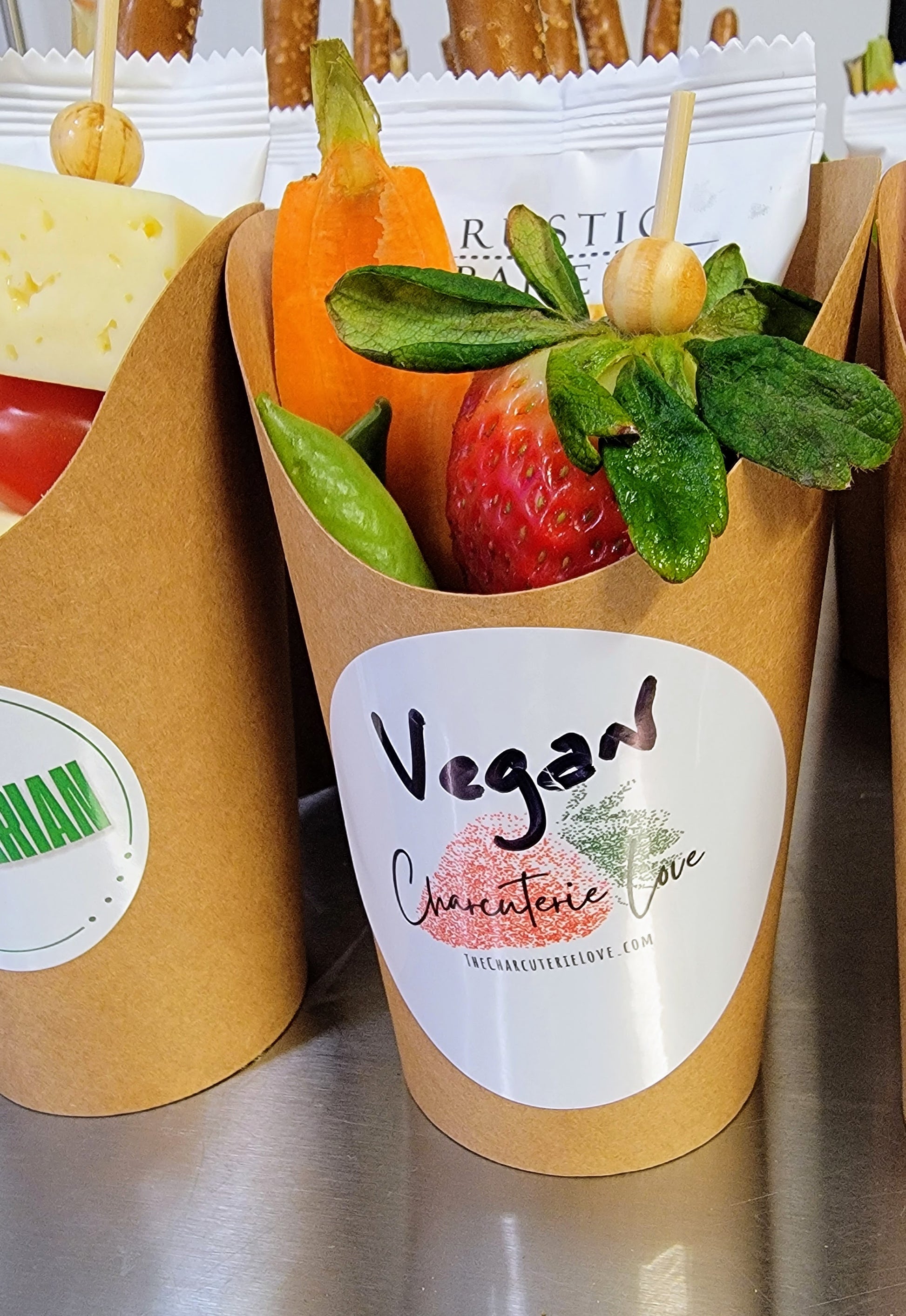 vegan charcuterie cup filled with plant based grazing items for events
