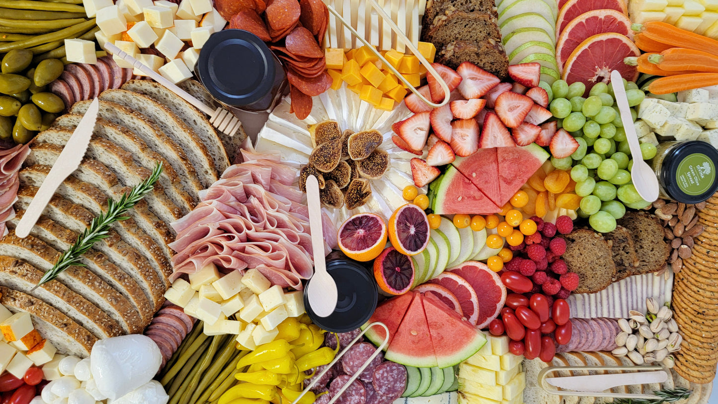 charcuterie board packed with fresh seasonal ingredients
