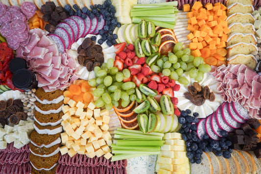 beautifully arranged charcuterie spread with meats cheeses fruit and nuts