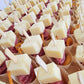 charcuterie cone filled with meat, cheese, fruit, nuts, and snacks arranged for events, parties, and grazing tables