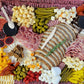 Colorful platter of assorted meats, cheeses, and vegetables