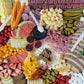 beautifully arranged platter with meats cheeses fruits and vegetables