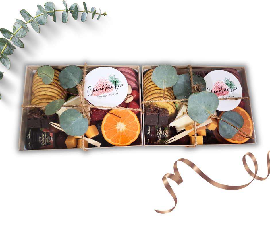 charcuterie box arranged with assorted meats cheeses fruits nuts and snacks