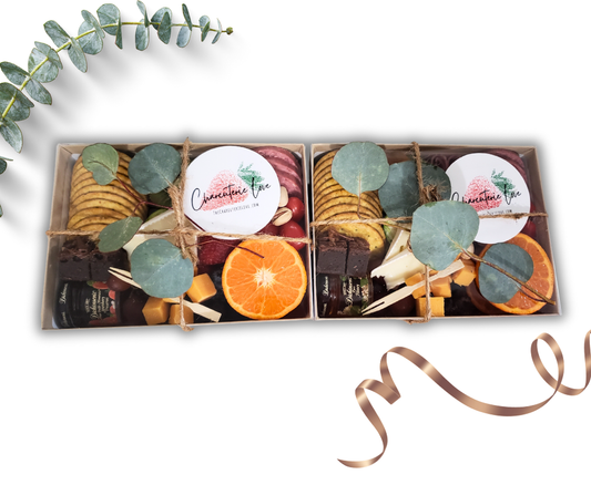 charcuterie box arranged with assorted meats cheeses fruits nuts and snacks