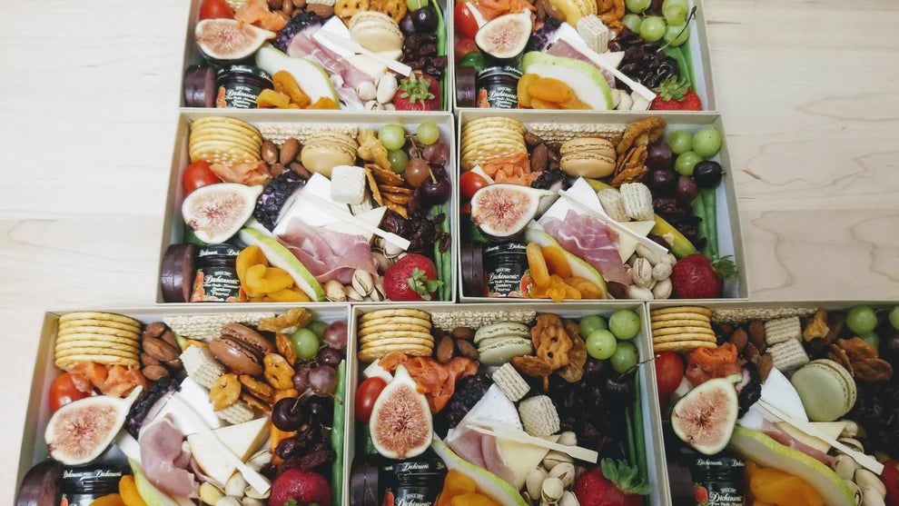 charcuterie box featuring a curated selection of savory and sweet grazing items