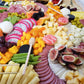artisan charcuterie board with a mix of savory and sweet items