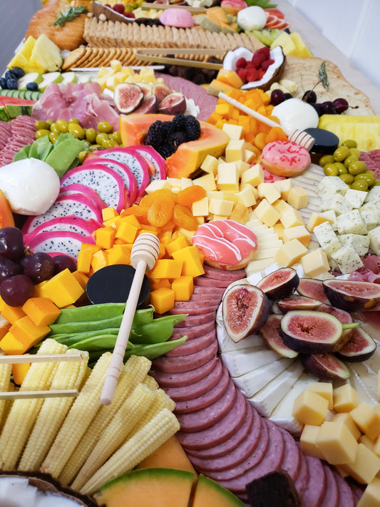 artisan charcuterie board with a mix of savory and sweet items